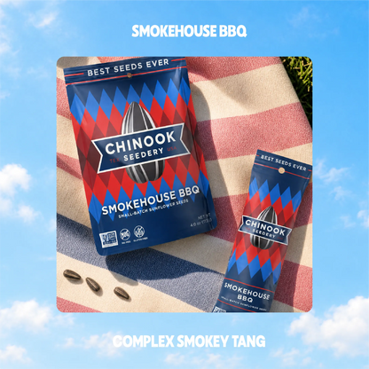 Smokehouse BBQ sunflower seeds in 4 oz and 1.5 oz bags on a striped beach towel
